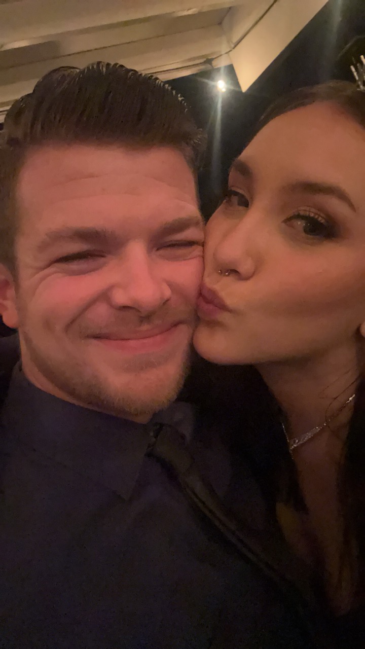 Kara kissing Brogan on the cheek